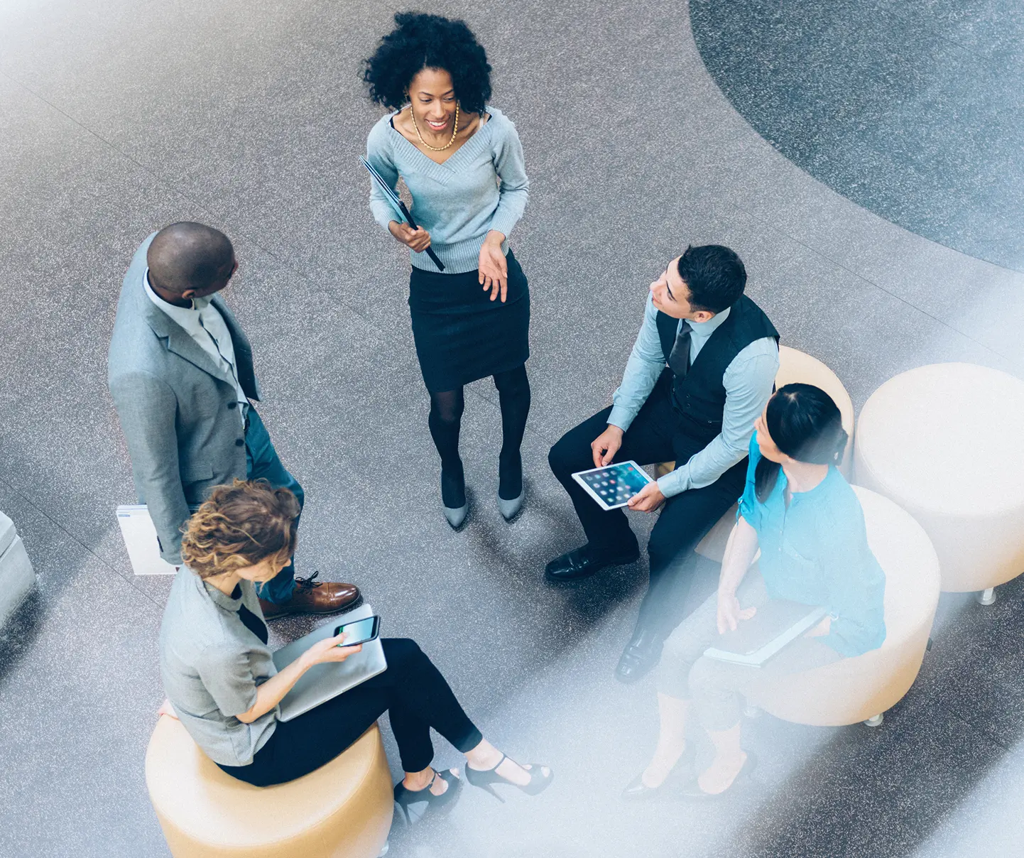 Business professionals discussing AI innovation.