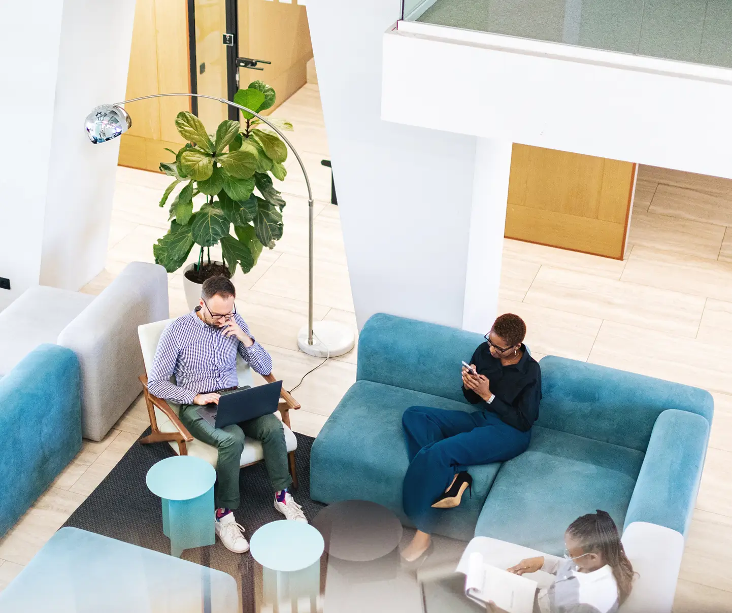 Three employees working on cyber threat management.