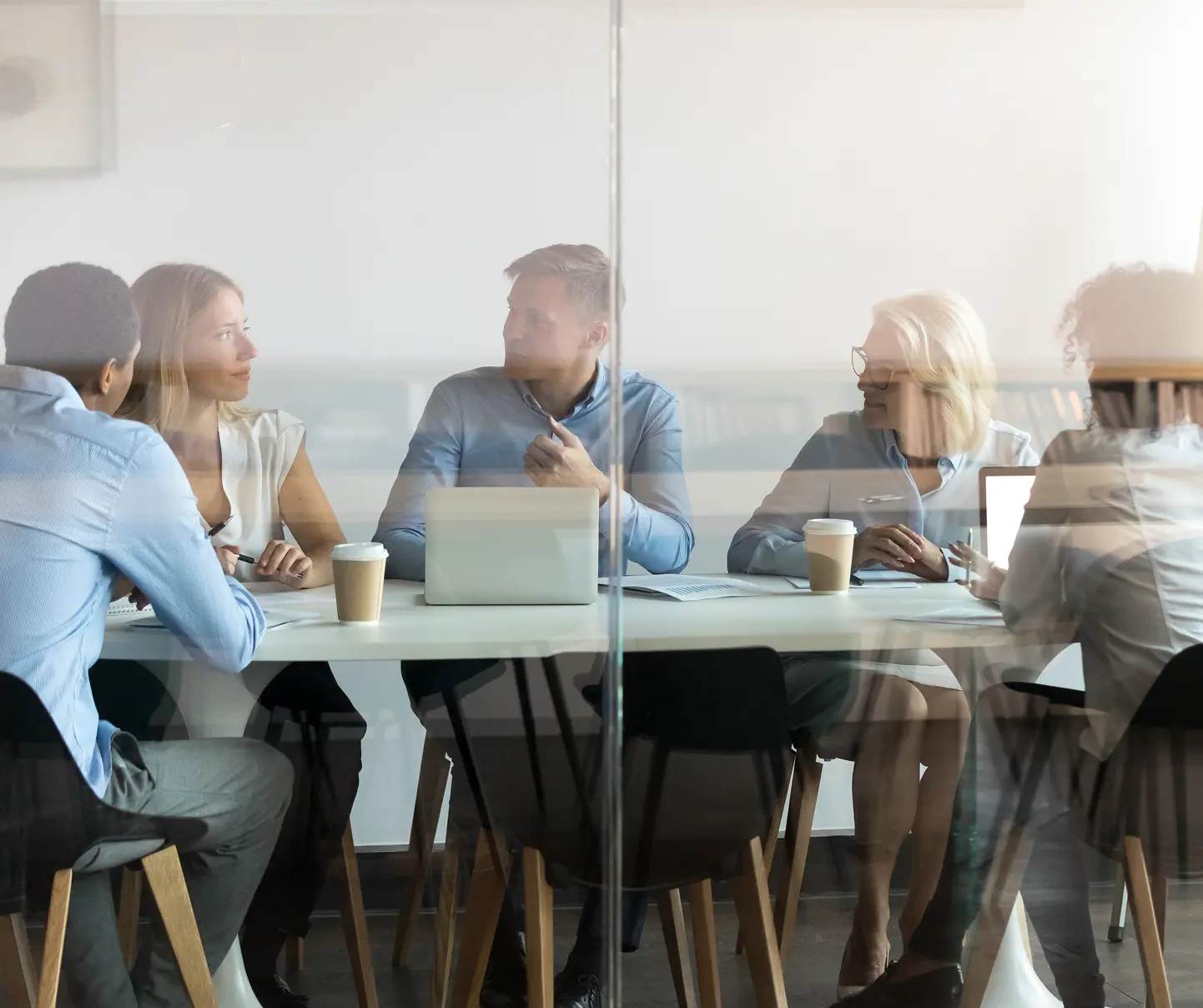 Collective Insights consultants discussing compliance with a client.